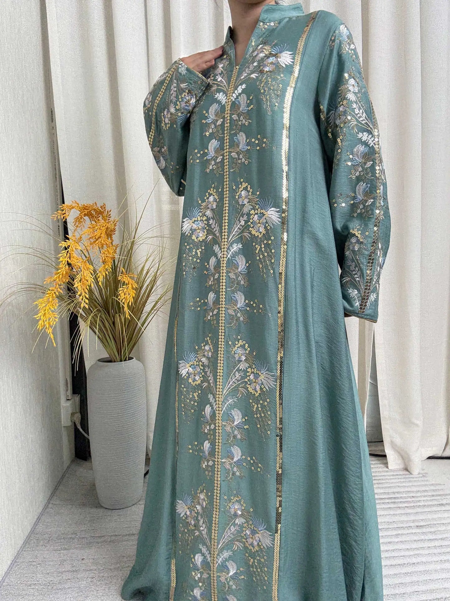Trendy Black Islamic Dress with Distinctive Neck Design and Gorgeous Embroidered Details for Modern Muslim Women's Occasions