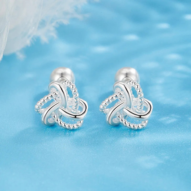 The S925 sterling silver stud earrings symbolize peace and good luck, representing high-end jewelry and a luxurious retro style