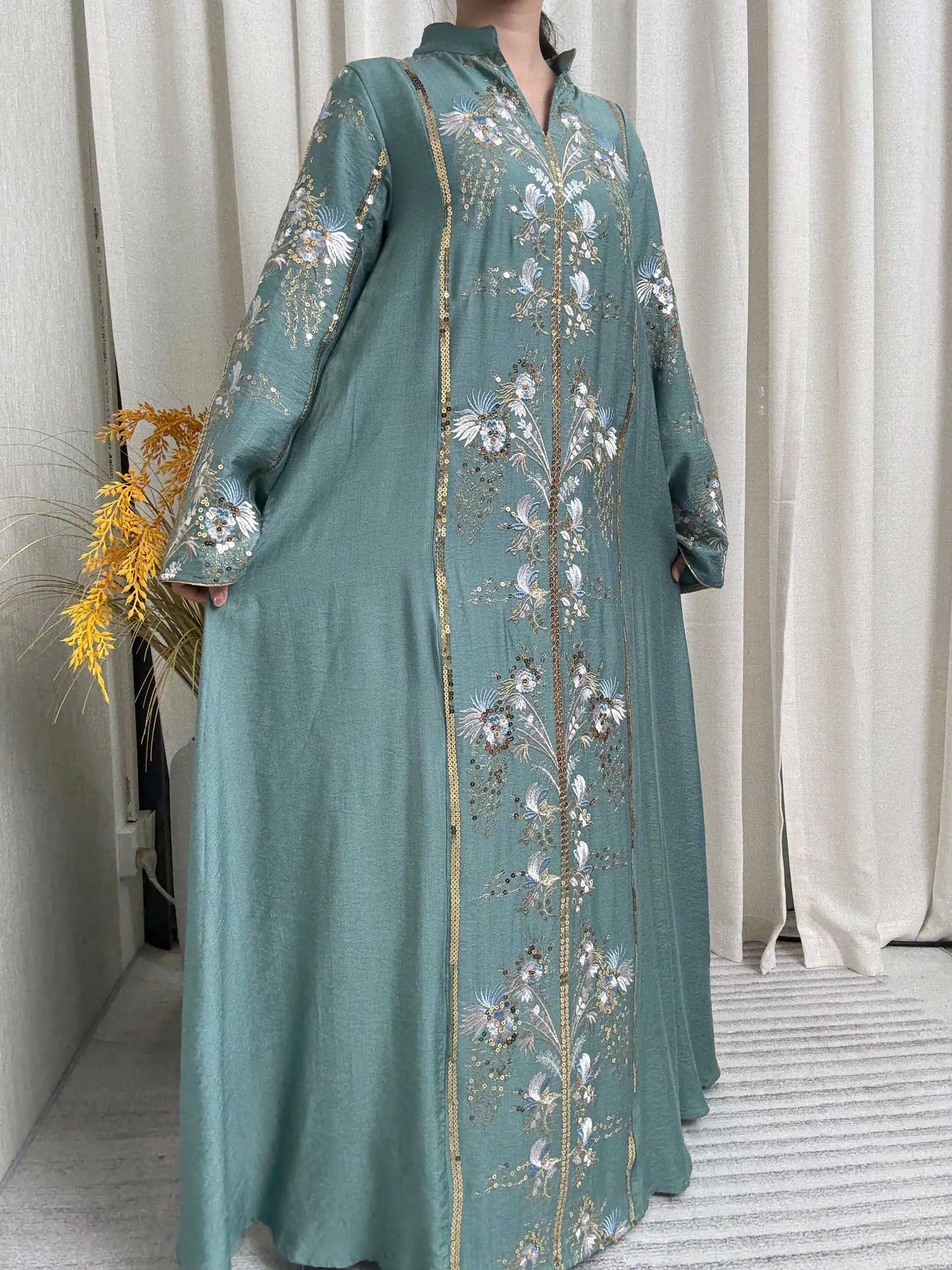 Trendy Black Islamic Dress with Distinctive Neck Design and Gorgeous Embroidered Details for Modern Muslim Women's Occasions