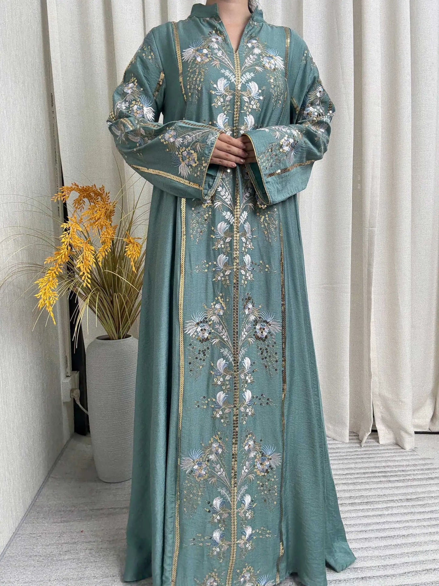 Trendy Black Islamic Dress with Distinctive Neck Design and Gorgeous Embroidered Details for Modern Muslim Women's Occasions