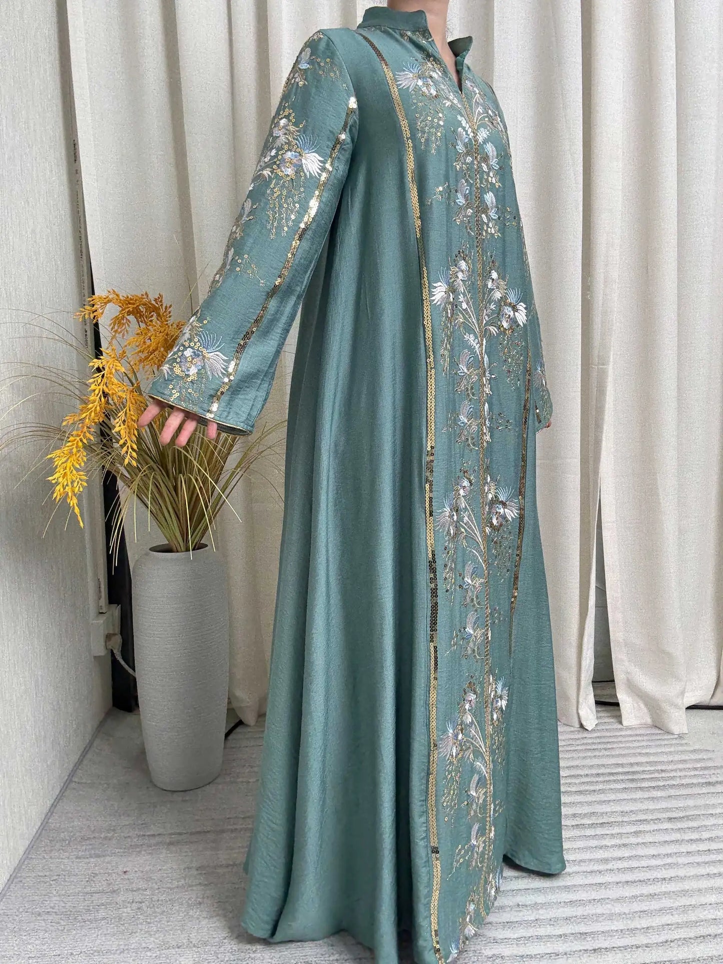 Trendy Black Islamic Dress with Distinctive Neck Design and Gorgeous Embroidered Details for Modern Muslim Women's Occasions