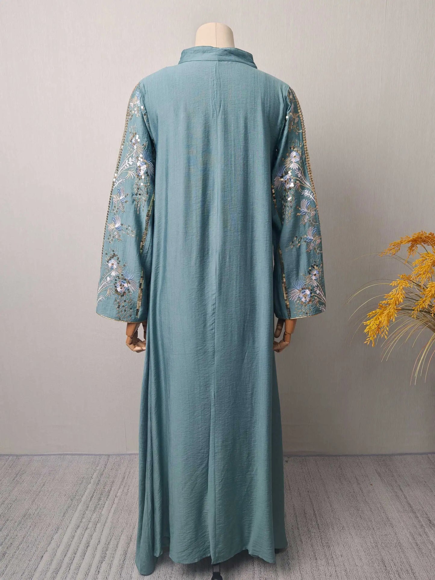 Trendy Black Islamic Dress with Distinctive Neck Design and Gorgeous Embroidered Details for Modern Muslim Women's Occasions