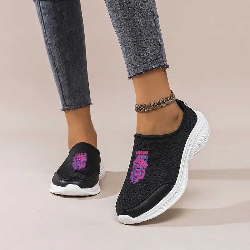 Women's Black Slip-On Sneakers: Platform Wedge Sole, Casual Comfort. Trendy Graphic Mesh Shoes for Daily & Commute Wear.