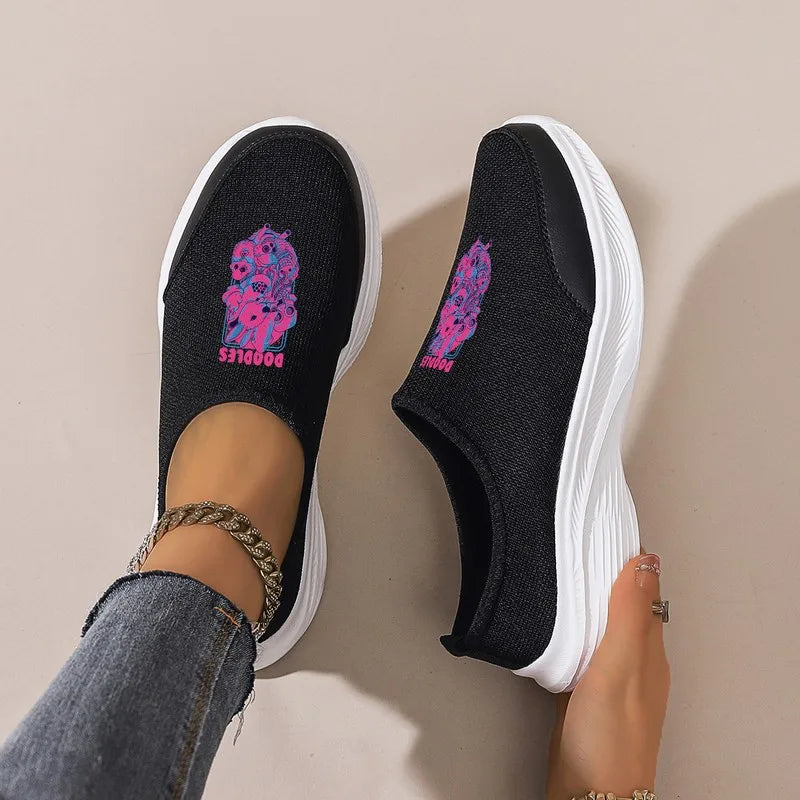 Women's Black Slip-On Sneakers: Platform Wedge Sole, Casual Comfort. Trendy Graphic Mesh Shoes for Daily & Commute Wear.