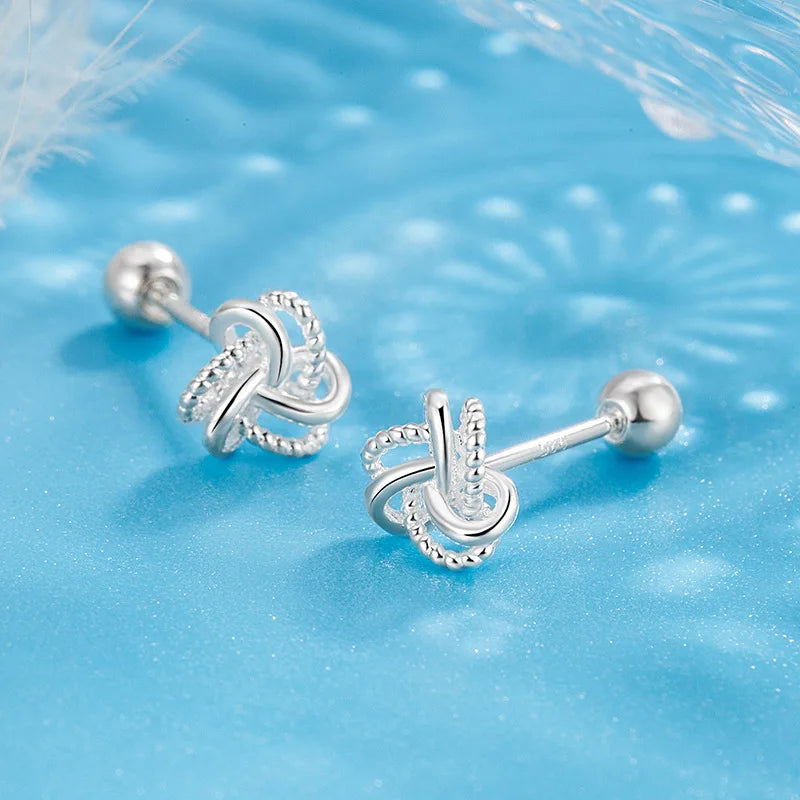 The S925 sterling silver stud earrings symbolize peace and good luck, representing high-end jewelry and a luxurious retro style