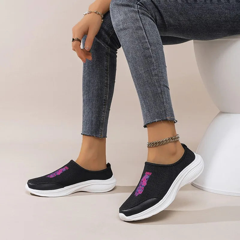 Women's Black Slip-On Sneakers: Platform Wedge Sole, Casual Comfort. Trendy Graphic Mesh Shoes for Daily & Commute Wear.
