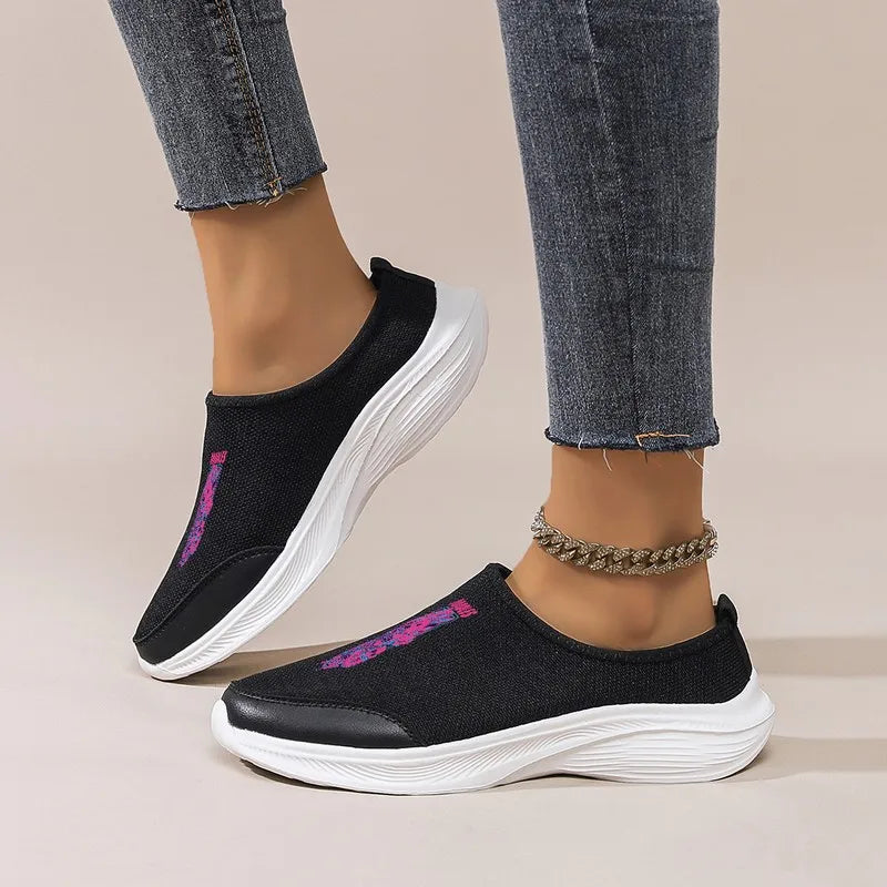 Women's Black Slip-On Sneakers: Platform Wedge Sole, Casual Comfort. Trendy Graphic Mesh Shoes for Daily & Commute Wear.