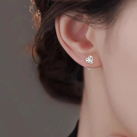 The S925 sterling silver stud earrings symbolize peace and good luck, representing high-end jewelry and a luxurious retro style