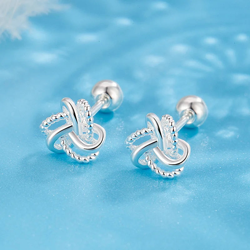 The S925 sterling silver stud earrings symbolize peace and good luck, representing high-end jewelry and a luxurious retro style