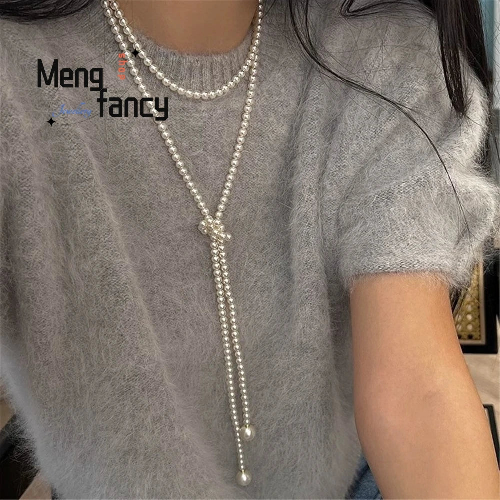This 130cm Long Glass Pearl Necklace Can Be Worn In Multiple Ways. The Long Necklace Is Elegant And Trendy. It's A Retro Sweater