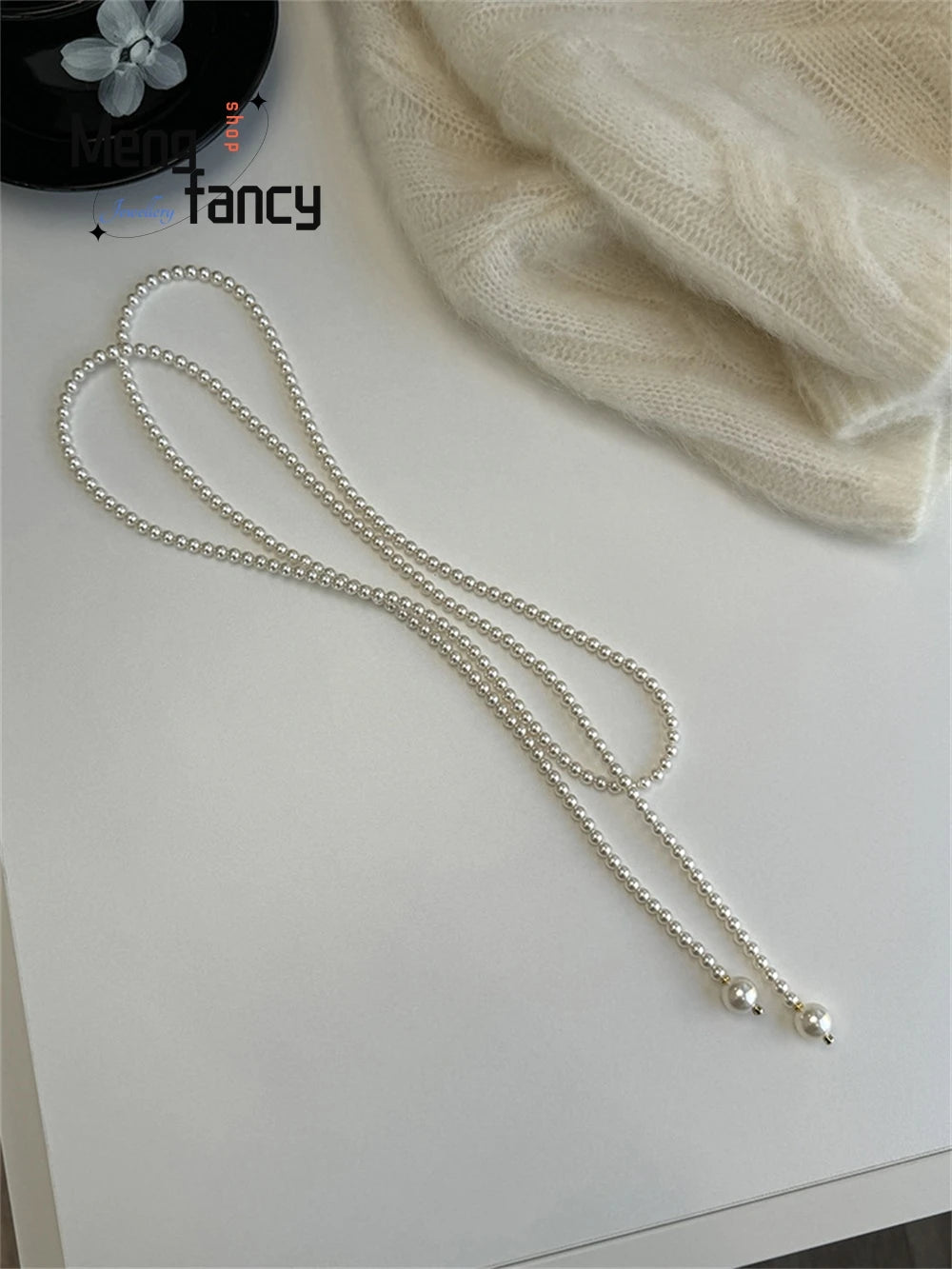 This 130cm Long Glass Pearl Necklace Can Be Worn In Multiple Ways. The Long Necklace Is Elegant And Trendy. It's A Retro Sweater