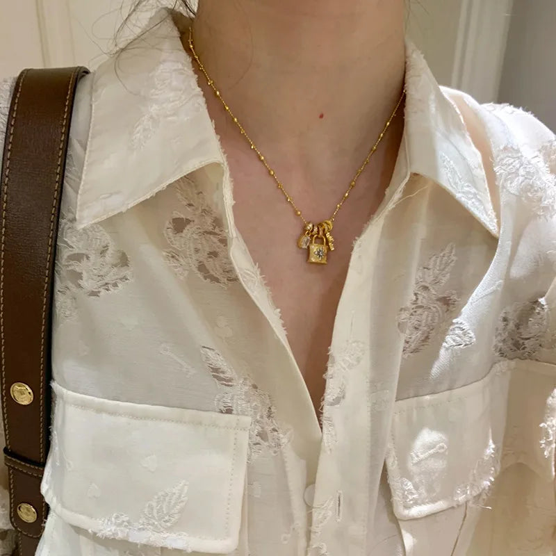 Lace craft running ring cross pendant lock bag necklace luxury premium feel collarbone chain niche new sweater chain